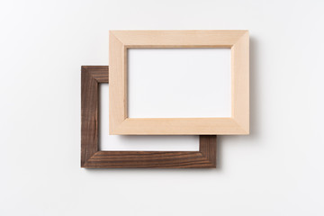 top view of two brown wood photo frame on white