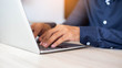 © chaunpis - A woman's hand using and touching on laptop touchpad stock photo