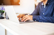 © chaunpis - A woman's hand using and touching on laptop touchpad stock photo