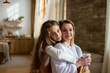 © Serafima - vertical portrait of european woman with daughter teenager