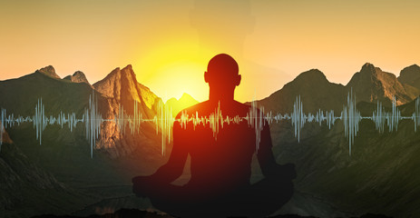 Wall Mural - yoga meditation illustration, silhouette of man practicing in mountains at sunset