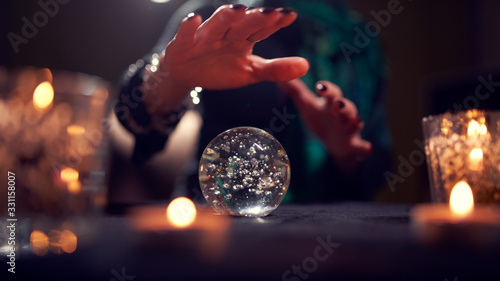 Fotografía Close-up of woman fortune-teller's hands with ball of predictions