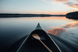 © Joonas Syrjälä - Scenic view of canoe in lake during sunset