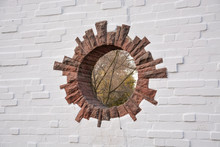 Round Hole In A Brick Wall In A Park Looks Like A Portal To Another Dimension