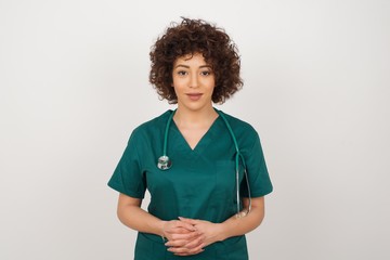 Business Concept - Portrait beautiful doctor woman holding hands with confident face isolated over gray Background.