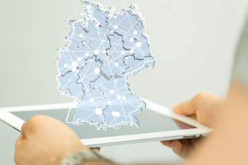 Leinwandbilder - a virtual germany land  map digital in hand 3d