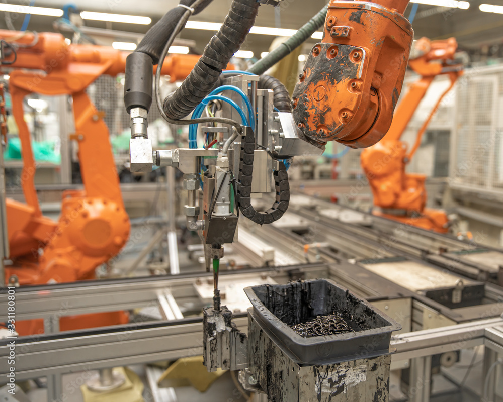 Automatic robotic arm in factory replaces human labor. Automation of ...
