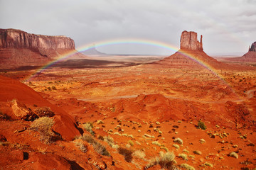 Wall Mural - Rainbow and red stone desert