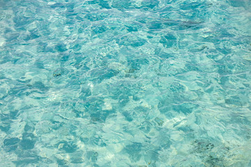 Beautiful tropical sea surface. Sunny hot summer ocean water environment.