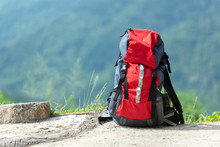 Hiking Backpack Travel Gear On Mountain. Items Include Hiking For Travel Destination And Leisure In Vacation. Flat Lay Of Outdoor Travel Equipment Items For Mountain Camping Trip.