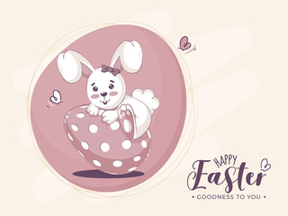 Sticker - Happy Easter, Goodness To You Font with Cartoon Bunny Climbing on Painted Egg.