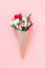 Roses Bouquet In Cone On Pink Background, Flat Lay, Top View.