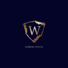 Letter W Alphabet logo design template. Luxury metallic gold security logo concept. isolated on navy blue background. Decorative floral shield sign illustration.