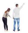 © ghoststone - Back view of couple in sweater pointing.