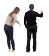 © ghoststone - Back view of couple in sweater pointing.