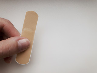 patch in hand on a white background.