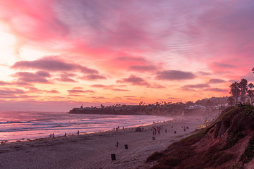 Wall Mural - People doing activities during sunset at the Pacific Beach, San Diego, California