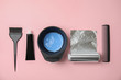 © New Africa - Professional tools for hair dyeing on pink background, flat lay