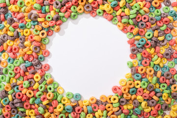 Sticker - top view of bright multicolored breakfast cereal arranged in round frame on white background