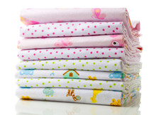A Stack Of Baby Diapers On A White Background