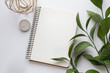 © arymer - notebook mockup with branch with green leaves. minimalistic mock up with notebook and plant
