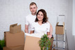 © Di Studio - young couple with cardboard boxes ready to moving day