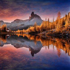 Leinwandbilder -  Scenic image of Fairy-tale Landscape with colorful overcast sky under sunlit, over the  Federa lake, Dolomites Alps. Best Popular places for Photographers. Wonderful Autumn Scenery during Sunset