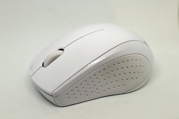 A white wireless mouse - lateral view