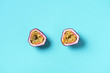 © jchizhe - Yellow maracuya on blue background. Top view. Copy space. Passion fruit. Creative design banner. Summer time. Tropical travel, exotic fruit. Vegan and vegetarian concept