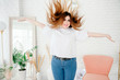© Валентина Свиридо - Happy plus size model in jeans and white t-shirt, tosses hair lifestyle. Young plump woman in casual outfit. The body is positive. The concept of one beauty. XXXL fashion