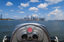 Close Up Of Binoculars Telescope With An Amazing Bokeh View Over The Hudson River And Manhattan Skyline