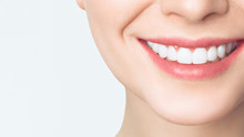Perfect Healthy Teeth Smile Of A Young Woman. Teeth Whitening. Dental Clinic Patient. Image Symbolizes Oral Care Dentistry, Stomatology.