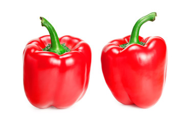 two red sweet bell peppers isolated on white background