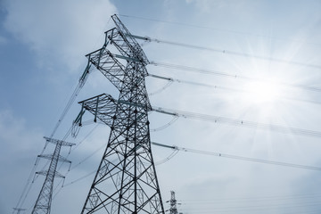 Wall Mural - transmission tower against a blue sky