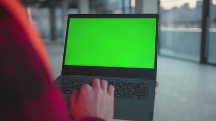 Wall Mural - Close up hands engineer using laptop computer with green screen typing inside building worker project occupation builder technology mock-up professional male safety device computer slow motion