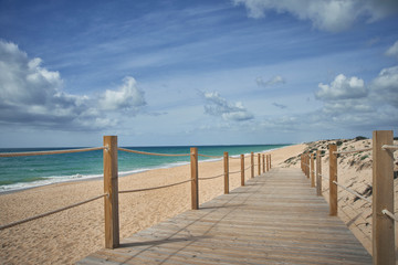 Faro, Algarve / Portugal - March 07, 2020: Atlantic ocean view. Typical beach in Algarve. Praia da Quinta do Lago