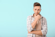 © Pixel-Shot - Sad man on color background