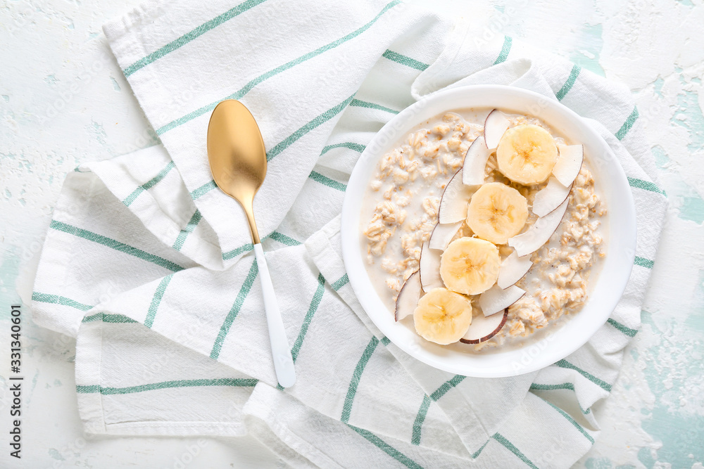 Bowl with tasty sweet oatmeal on color background - obrazy, fototapety, plakaty 