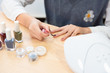 © 浩然 张 - A young woman paints her own nail polish at home