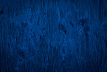 The Texture Of Navy Blue Wood. Texture Of Old Dried Plywood. Classic Blue Background For Design.