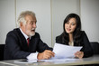 © tuiphotoengineer - businessmen holding documents for business partners discussing  and share ideas at meeting and business women smiling happy for working