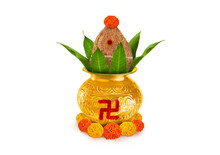 Copper And Gold Kalash With Coconut And Mango Leaf With Marigold Flower Decoration At The Bottom For Hindu Puja  For All Hindu Pooja Occasions 