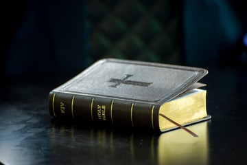 Holy bible book on black desk in church,prepare to study bible in christian religion.