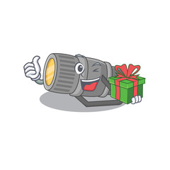 Sticker - Smiley underwater flashlight cartoon character having a gift box