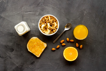 Wall Mural - Morning granola near toast on grey background top-down frame