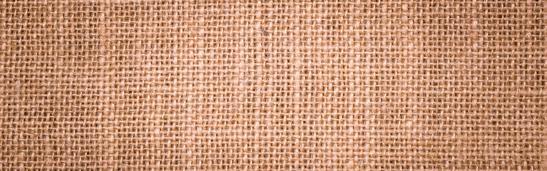 Wall Mural - Rough hessian background with flecks of varying colors of beige and brown. with copy space. office desk concept, Hessian sackcloth burlap woven texture background.