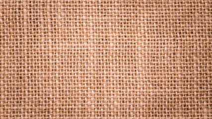 Wall Mural - Rough hessian background with flecks of varying colors of beige and brown. with copy space. office desk concept, Hessian sackcloth burlap woven texture background.