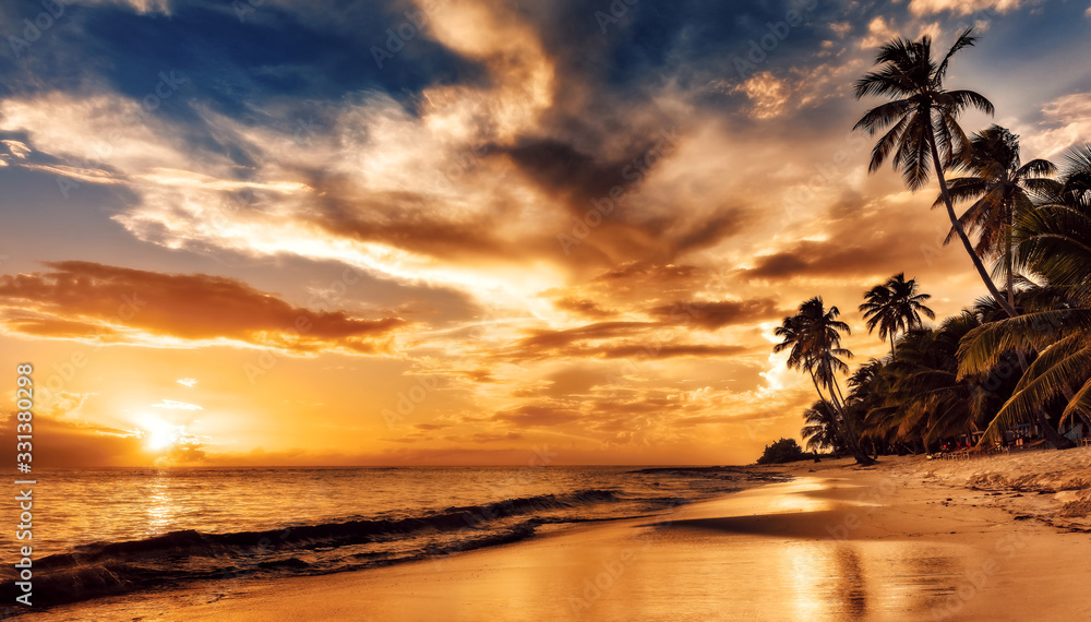 Sunset on the beach. Paradise beach. Tropical paradise, white sand, beach, palm trees and clear water. - obrazy, fototapety, plakaty 