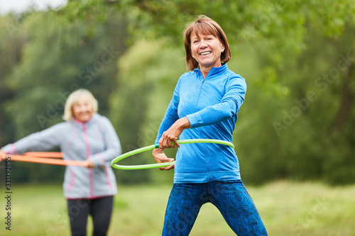 Senior women do exercise with the tire