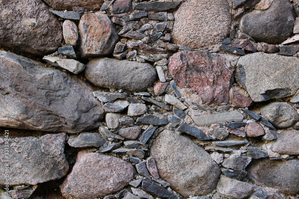 Old wall made of rocks. Medieval surface made of bricks. Texture of an ...